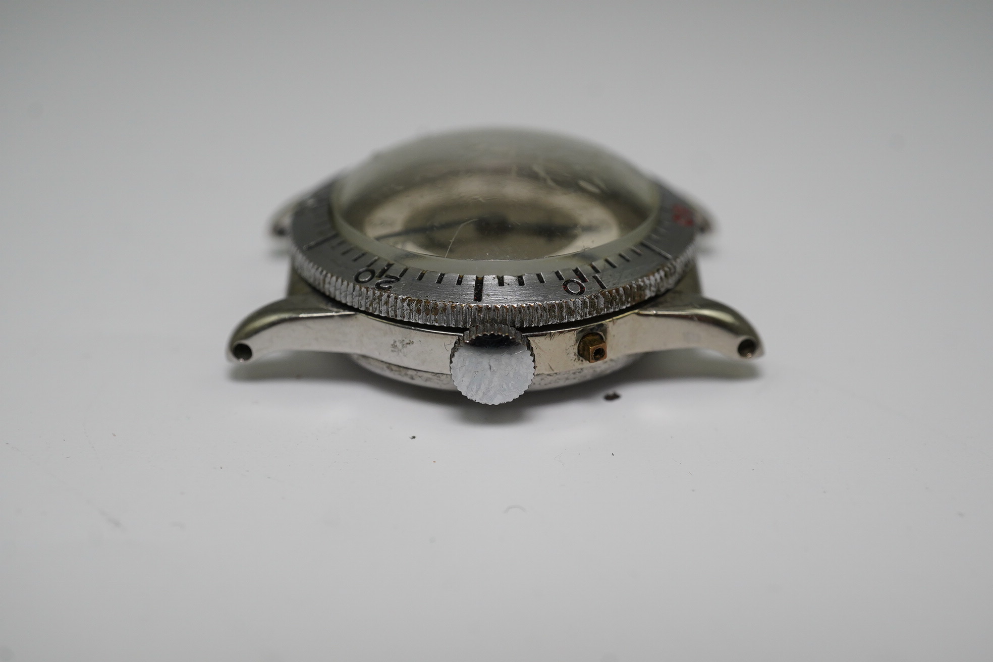 A gentleman's late 1930's steel Longines Weems U.S Patent military pilot's manual wind wrist watch, with Arabic dial, movement c.10L, case diameter 28mm, lacking one crown, no strap. Condition - poor